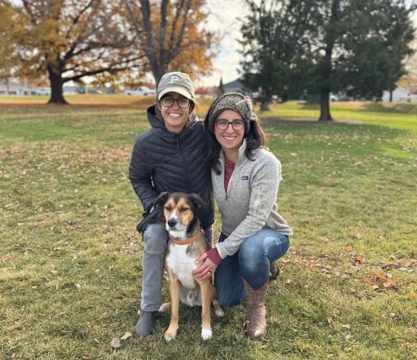 dog owner with small white dog