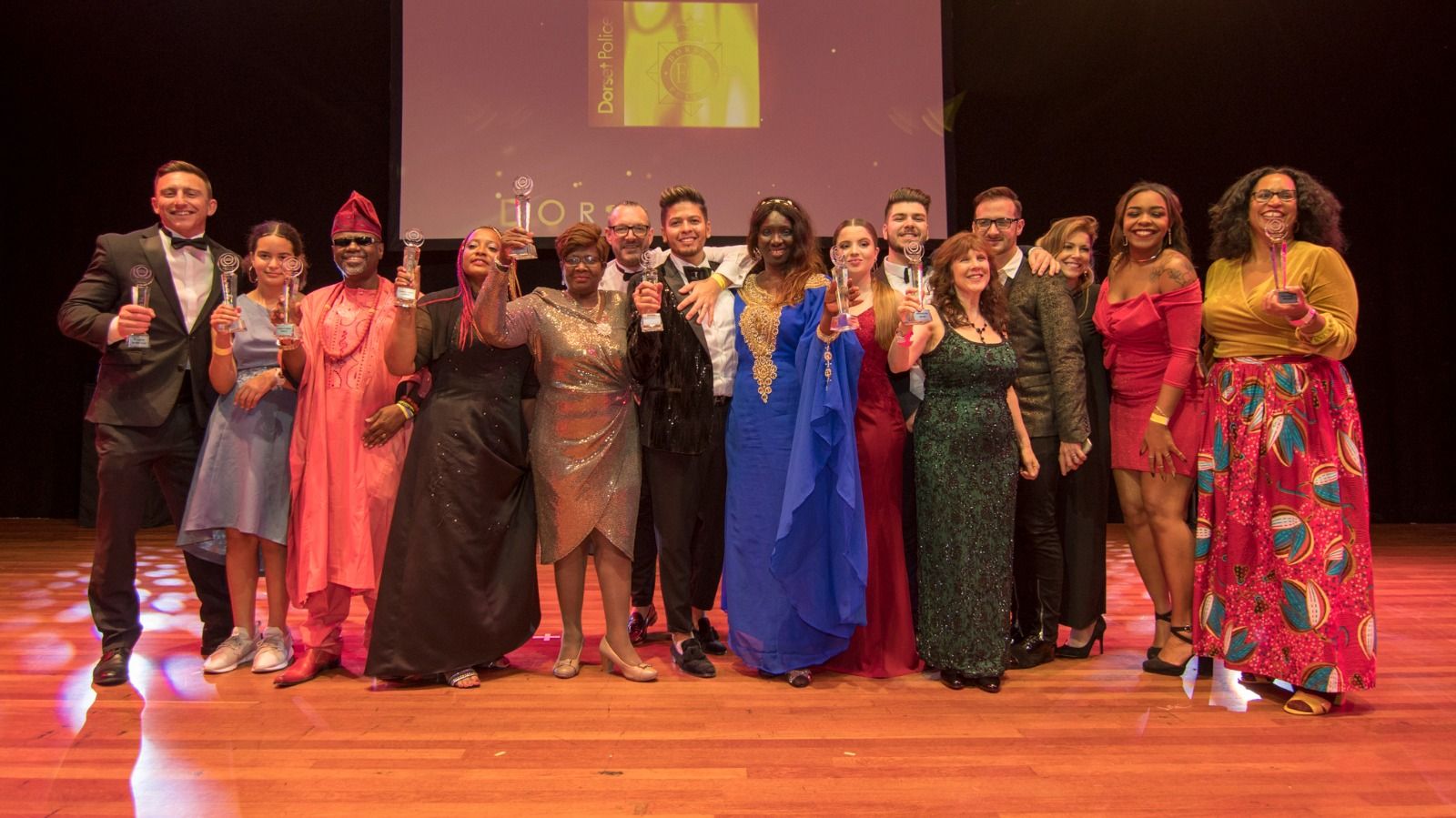 A large group gathered on stage at the end of the ceremony