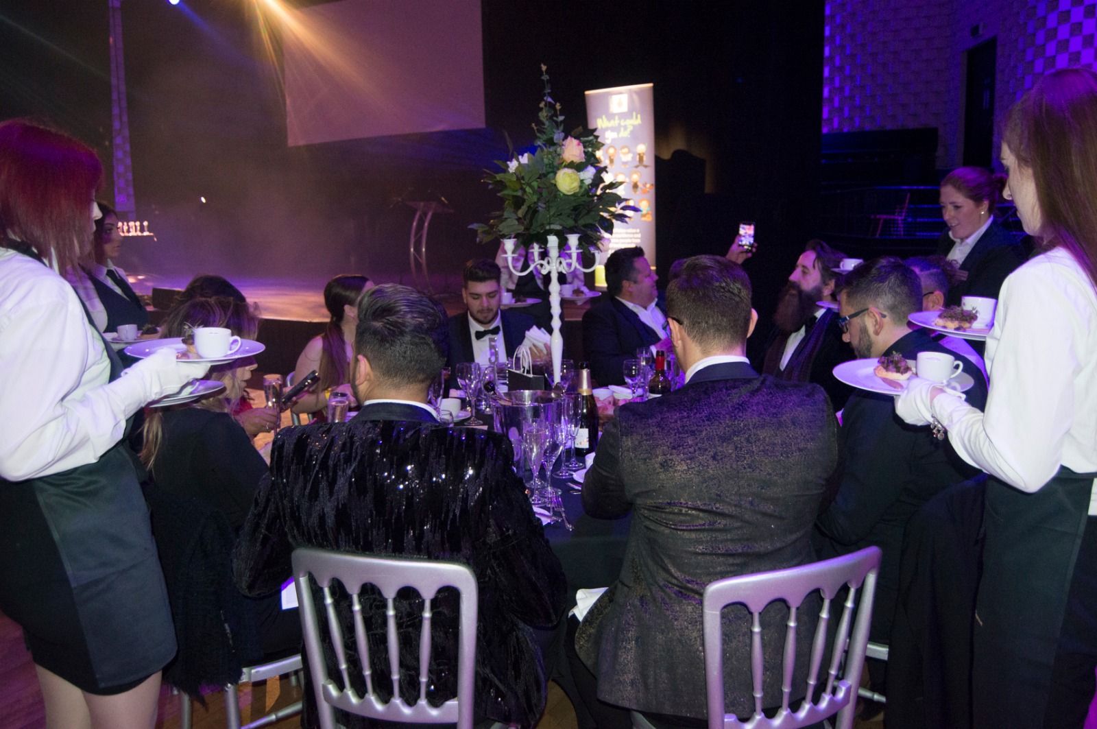 Waiting staff serving guests at their tables