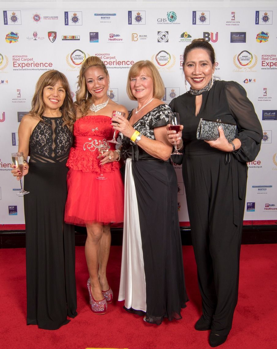 Four guests in evening gowns on the red carpet