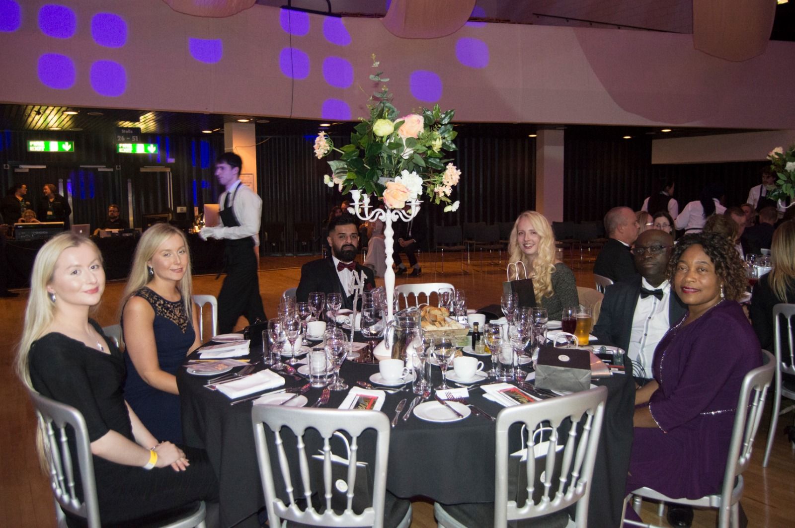 A table of guests enjoying the evening