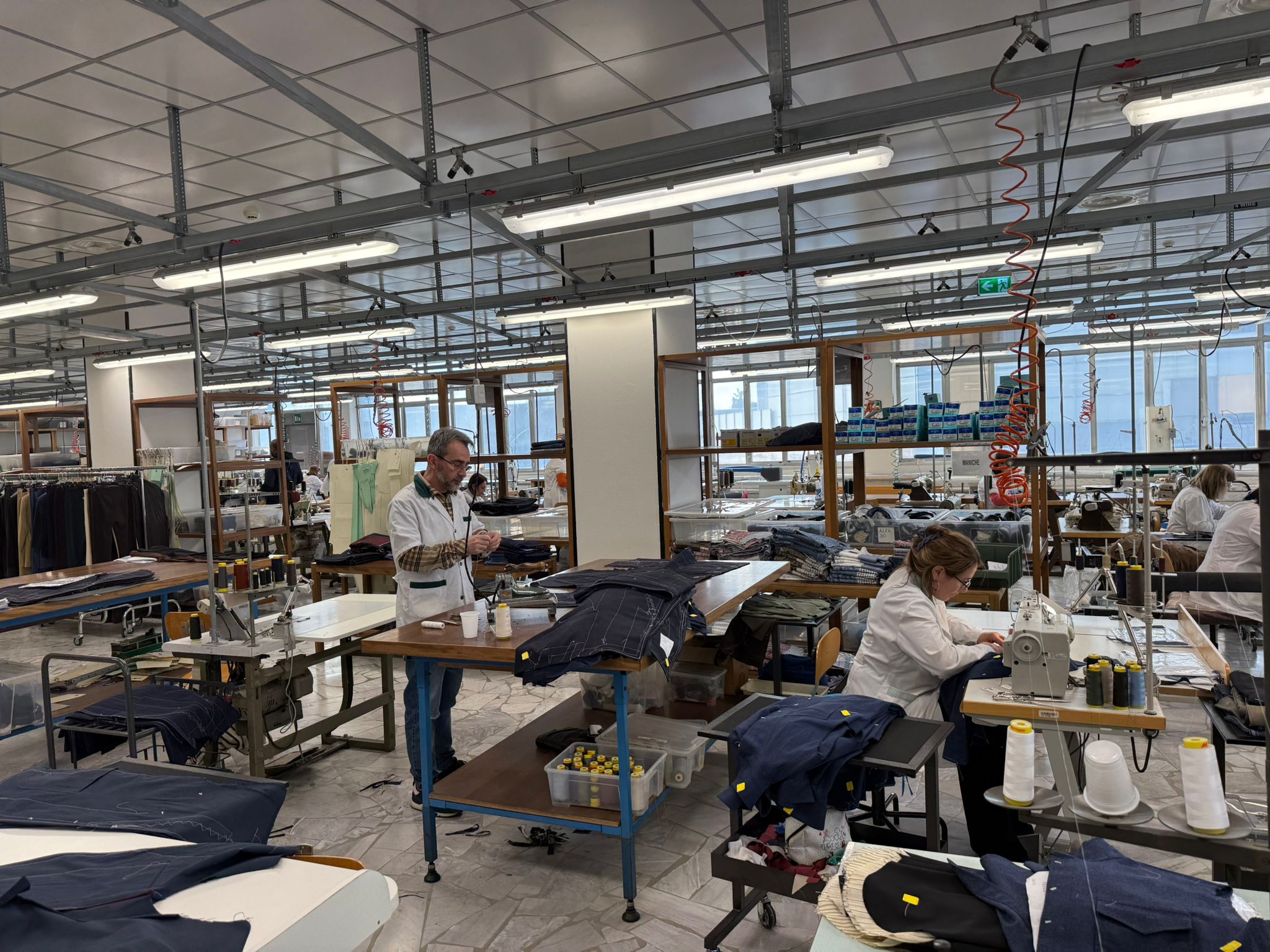 Textile factory floor with workers sewing