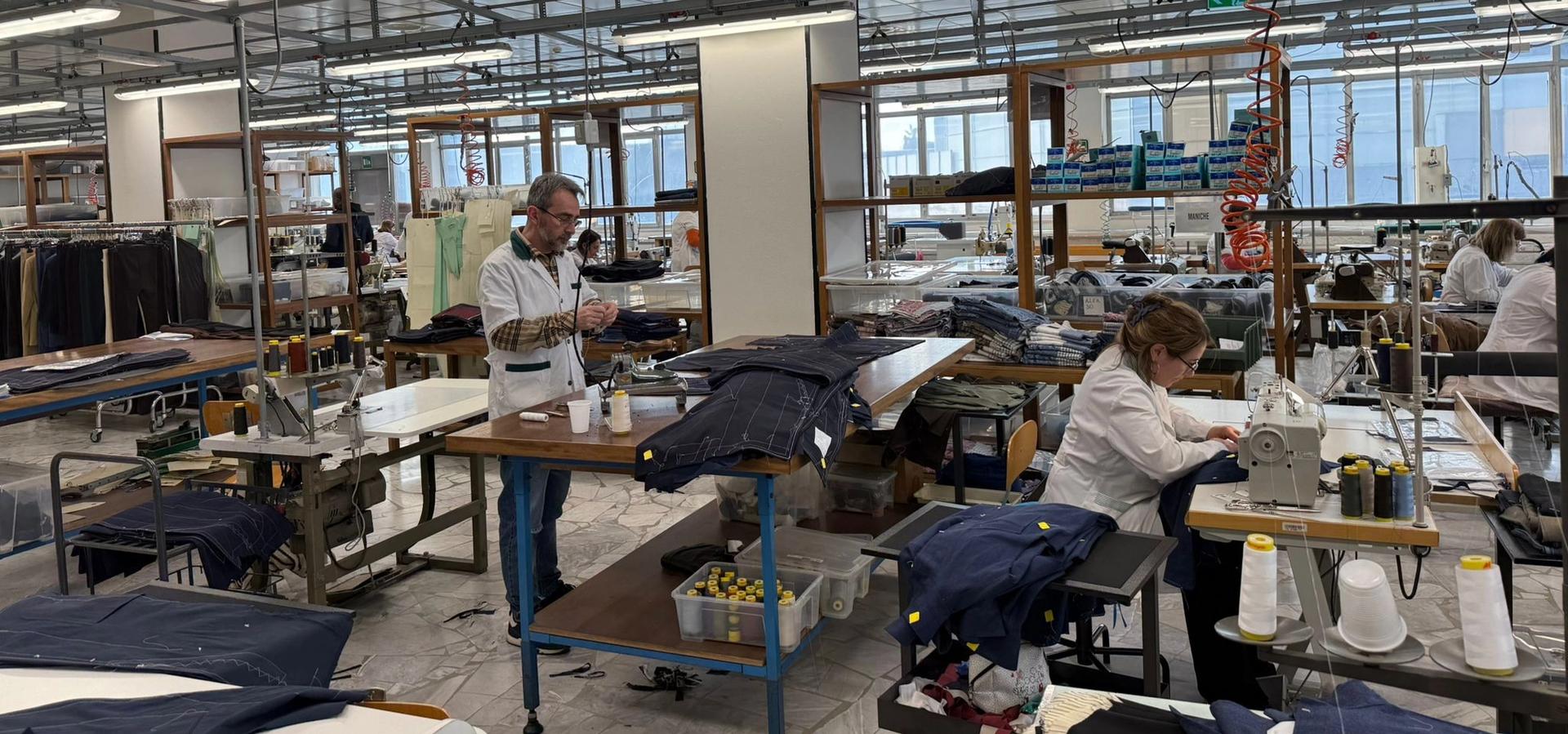 Textile factory floor with workers sewing