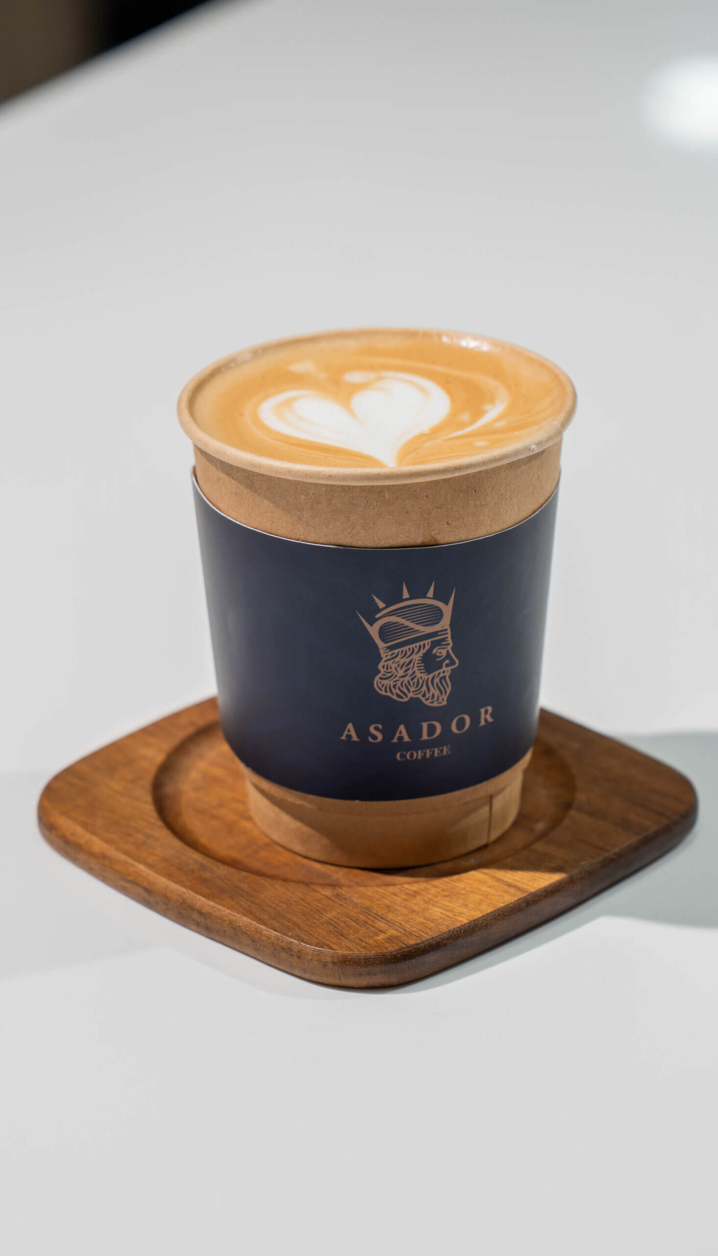 Barista Pouring Latte Art on Flat White Coffee at Asador Coffee El Jadida