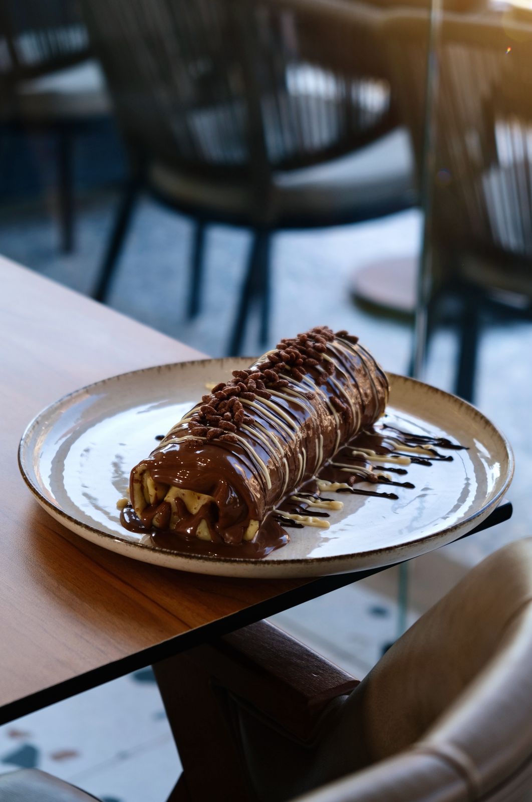 Mighty Crepe Rolled with Cake and Banana Filling with Double Chocolate Drizzle at Asador Coffee El Jadida