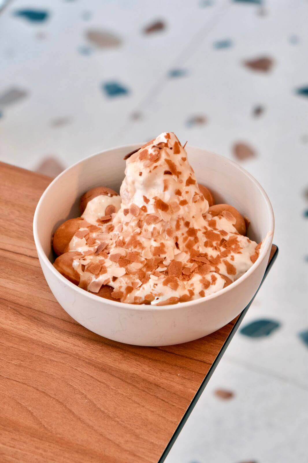 Raffaello Cake Bombs Bowl with Ice Cream and Crispy Feuilletine Flakes at Asador Coffee El Jadida