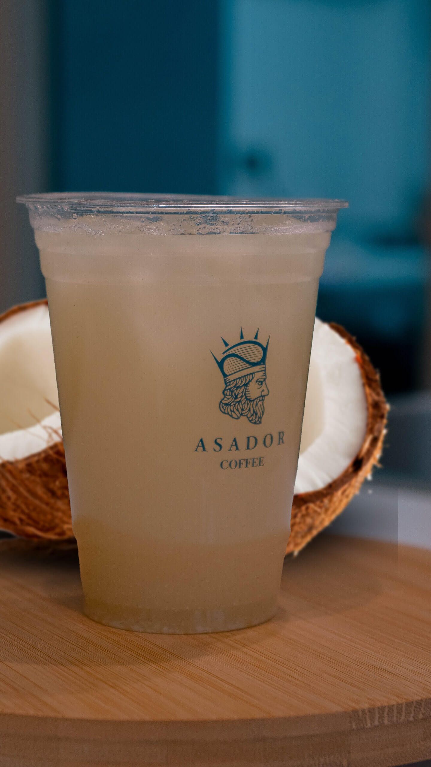 Iced Piña Colada Lemonade with Pineapple and Coconut Flavor in Plastic Cup at Asador Coffee El Jadida