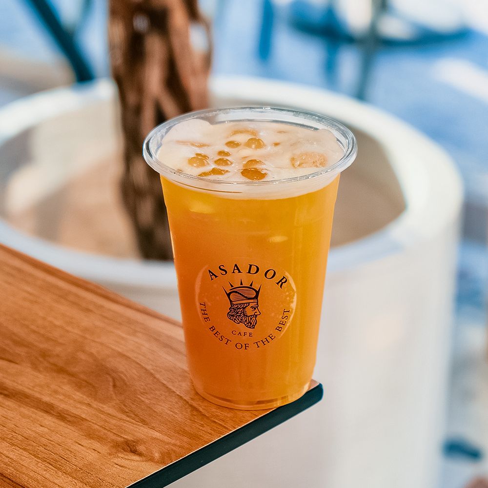 Iced Orange and Passion Fruit O'Hana Bubble Drink with Popping Boba in Plastic Cup at Asador Coffee El Jadida