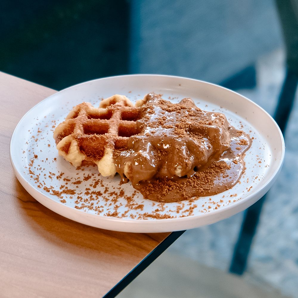 Freshly Baked Lotus Waffle with Caramelized Biscoff Spread and Biscuits at Asador Coffee El Jadida