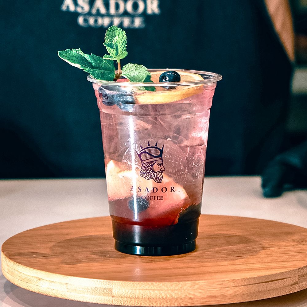 Iced Blueberry Mojito Berry Splash with Fresh Mint in Plastic Cup at Asador Coffee El Jadida