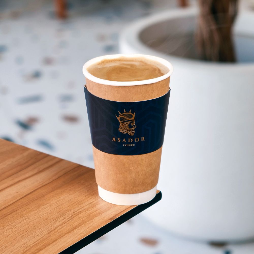 Steaming Hot Americano Coffee in Branded Takeaway Cup at Asador Coffee El Jadida
