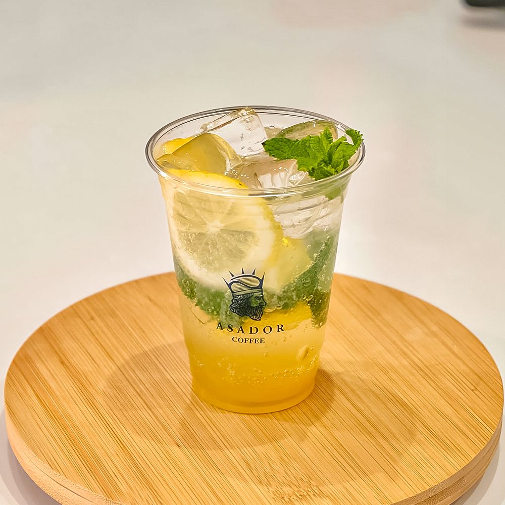 Classic Virgin Mojito with Fresh Mint and Lemon Slices in Plastic Cup at Asador Coffee El Jadida
