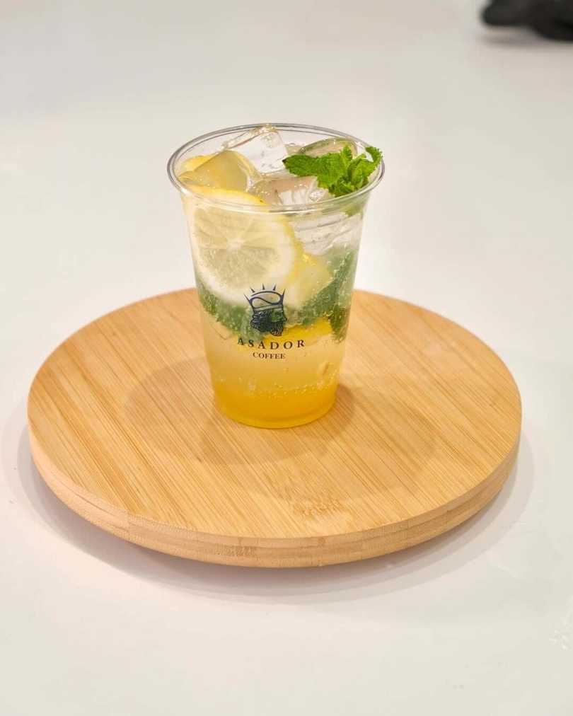 Classic Virgin Mojito with Fresh Mint and Lemon Slices in Plastic Cup at Asador Coffee El Jadida