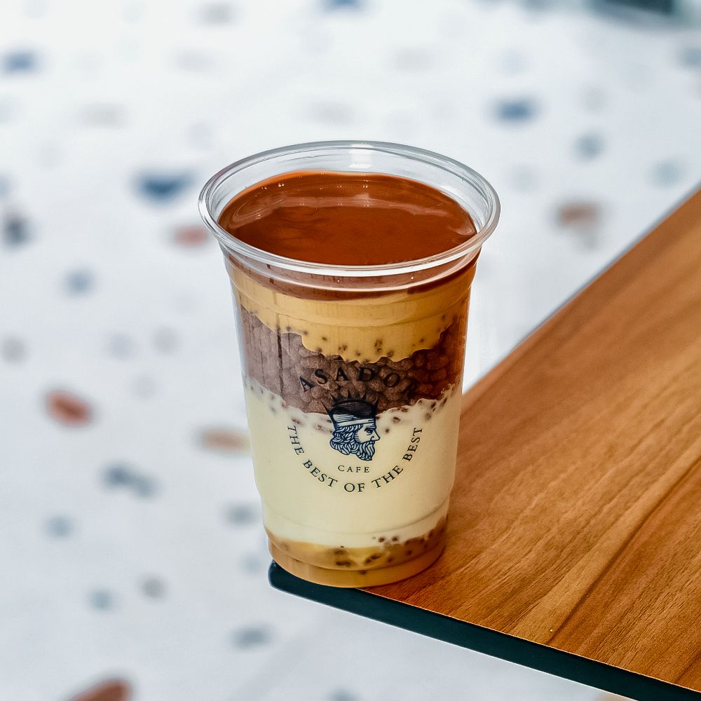 Kinder Bueno Ice Cream Drink with Crispy Rice Topping in Plastic Cup at Asador Coffee El Jadida