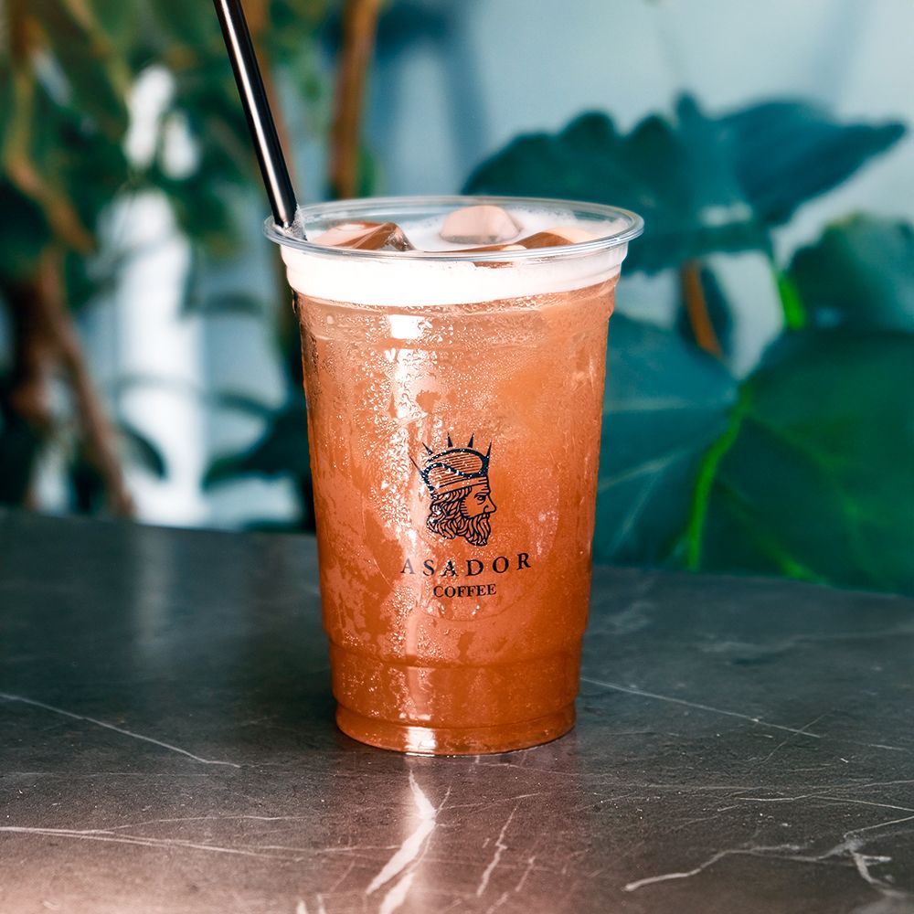 Iced Peach Tea Drink in Plastic Cup at Asador Coffee El Jadida