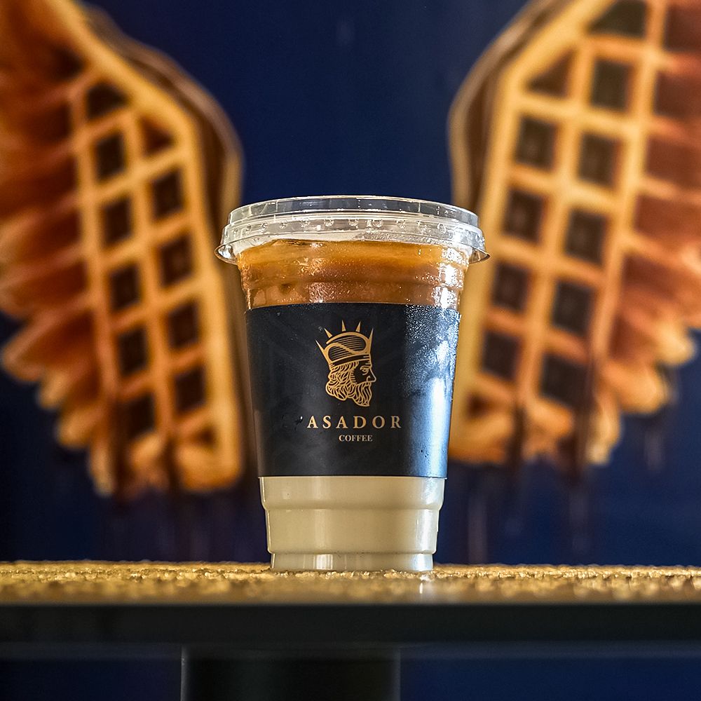 Iced Popcorn Latte with Layered Espresso and Milk at Asador Coffee El Jadida