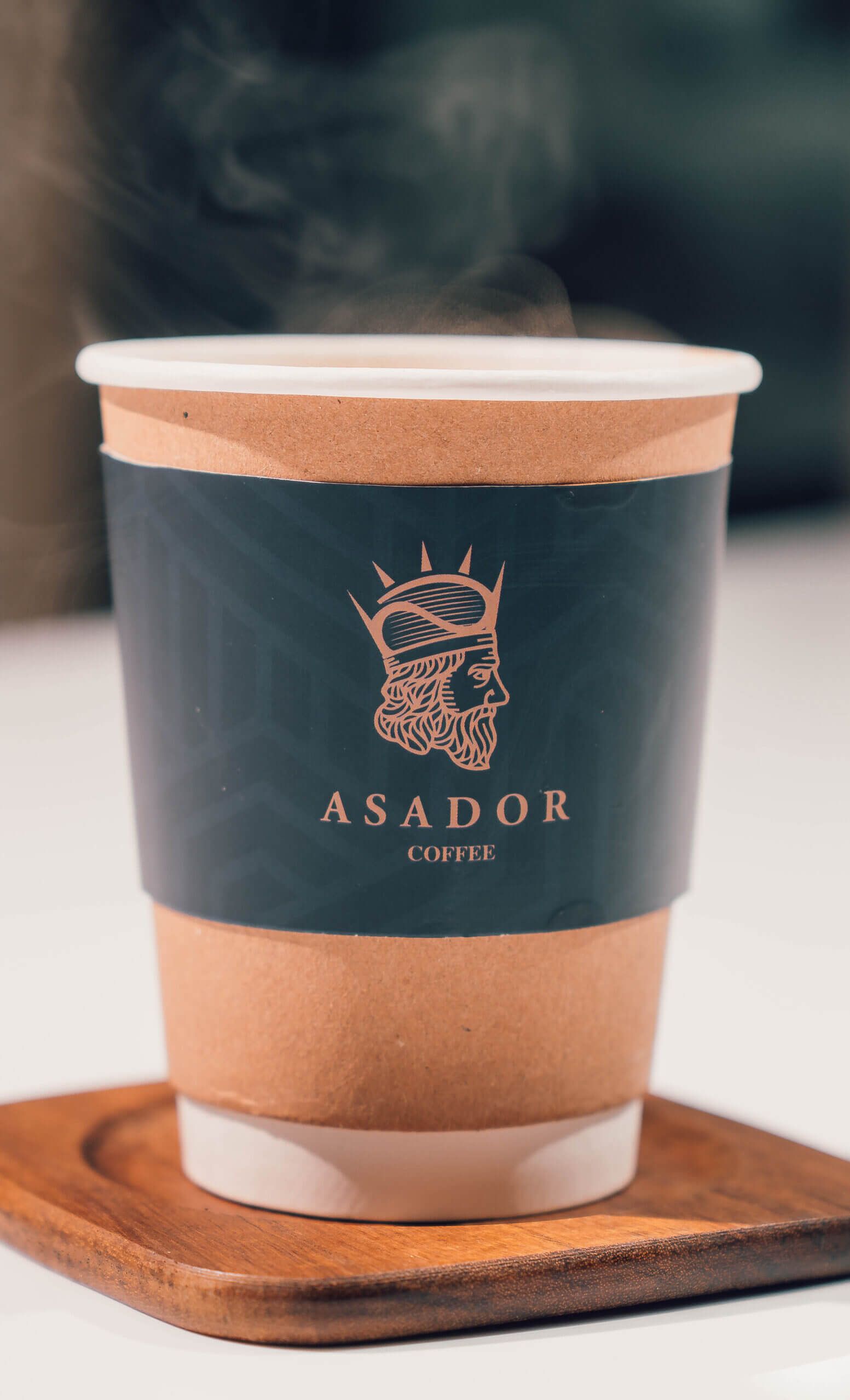 Steaming Hot Americano Coffee in Branded Takeaway Cup at Asador Coffee El Jadida