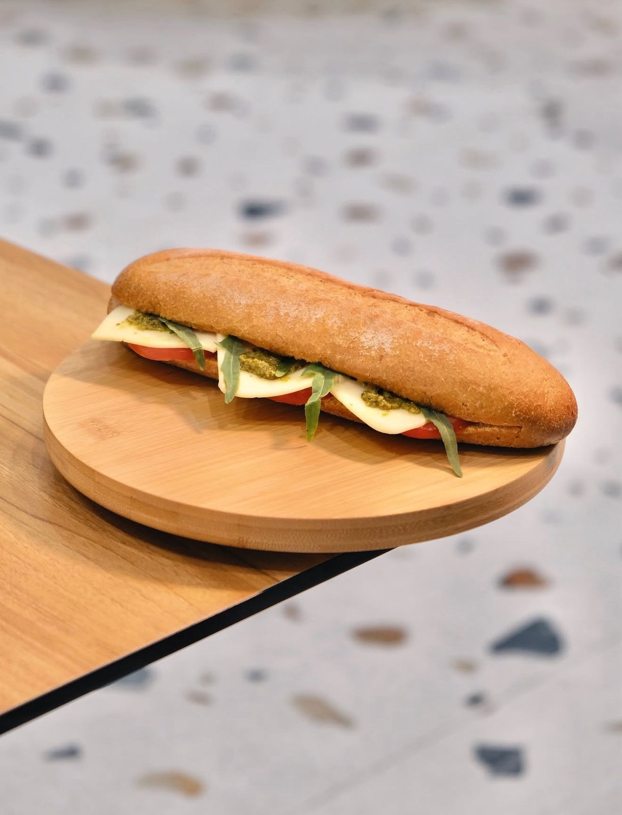 Vegetarian Pesto and Cheese Sandwich on Wooden Plate at Asador Coffee El Jadida