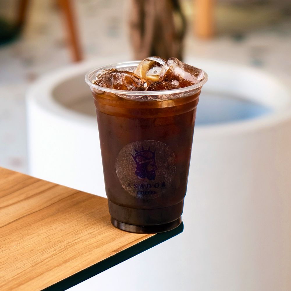 Iced Americano Black Coffee with Espresso Shot Glass and Coffee Beans at Asador Coffee El Jadida