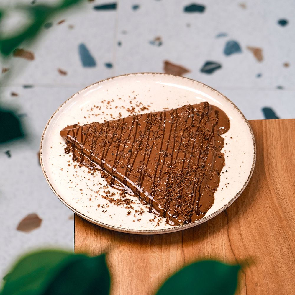 Folded Crepe Chocolate & Cookies with Double Chocolate Drizzle and Cookie Crumbles at Asador Coffee El Jadida