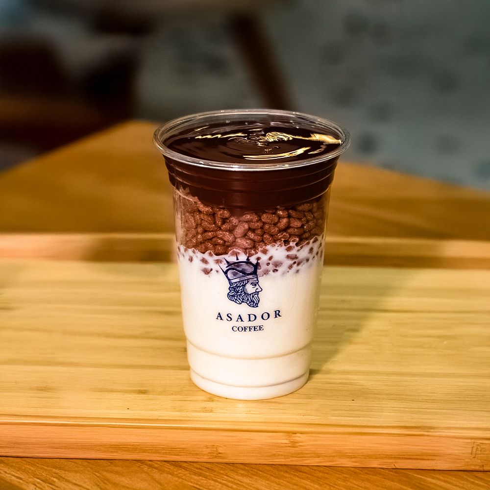 Dark Chocolate Ice Cream Drink with Layer of Crispy Rice in Plastic Cup at Asador Coffee El Jadida