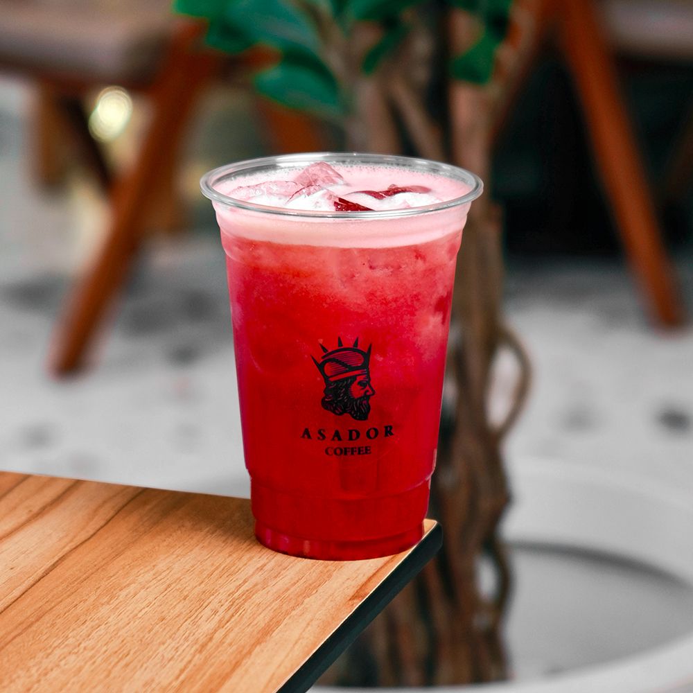 Iced Red Berry Lemonade with Fresh Strawberry and Blackberry Garnish at Asador Coffee El Jadida