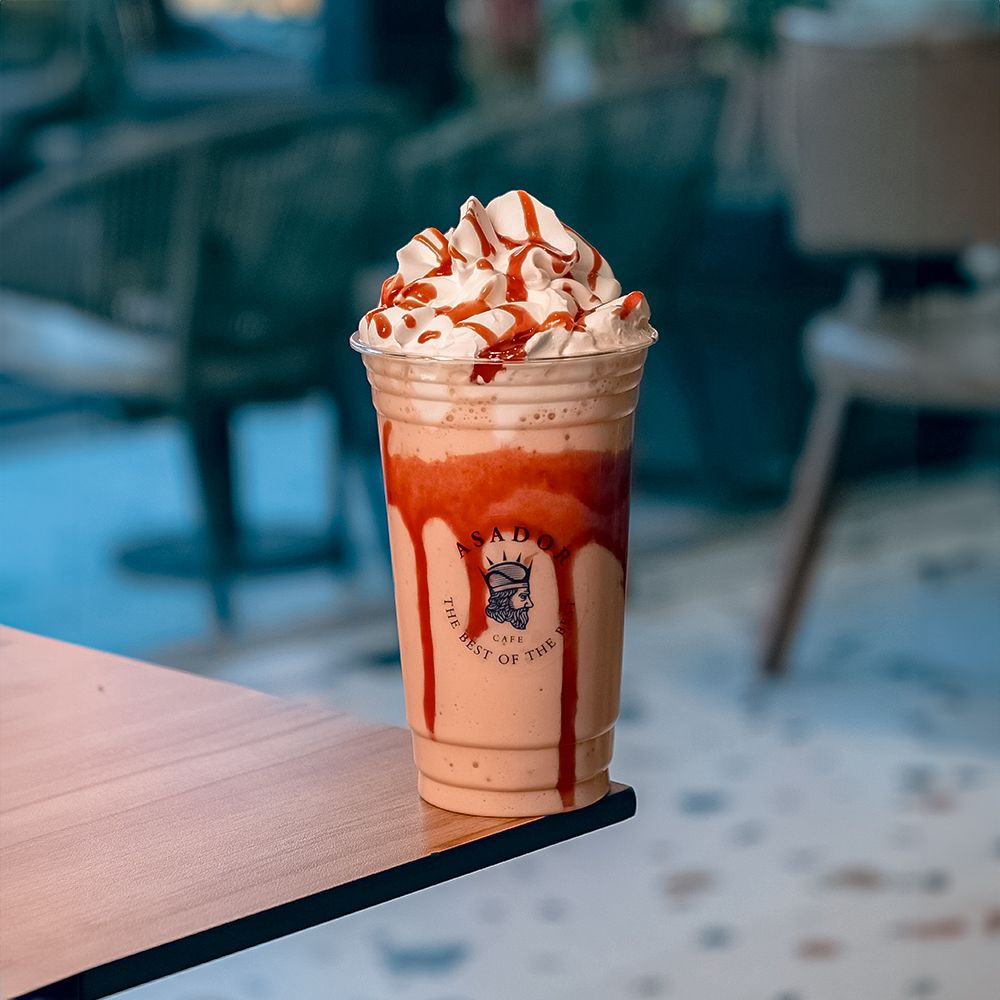 Pink Bubbaloo Bubblegum Milkshake with Whipped Cream and Red Syrup Drizzle at Asador Coffee El Jadida
