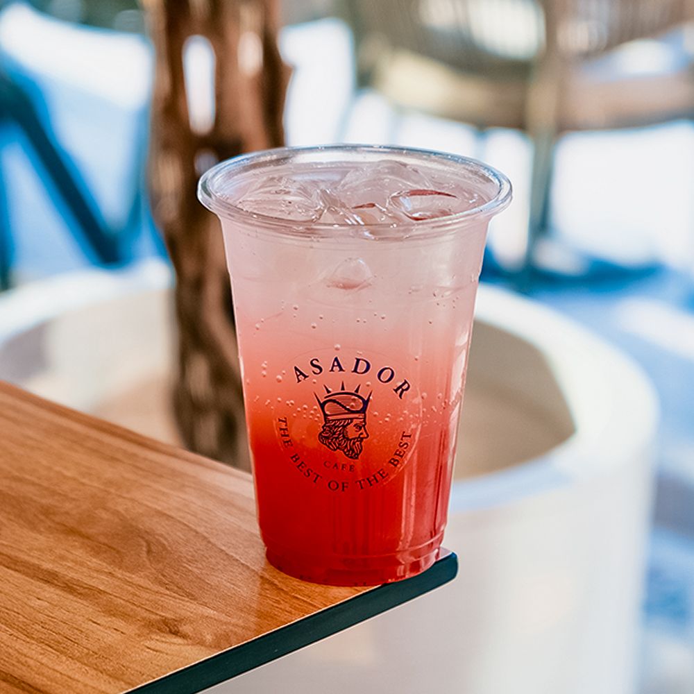 Pink Bubbly Flamingo Drink with Strawberry and Bubble Gum Flavor in Plastic Cup at Asador Coffee El Jadida