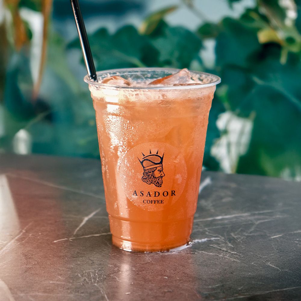 Iced Lemon Tea Drink with Fresh Lemon Slices in Plastic Cup at Asador Coffee El Jadida
