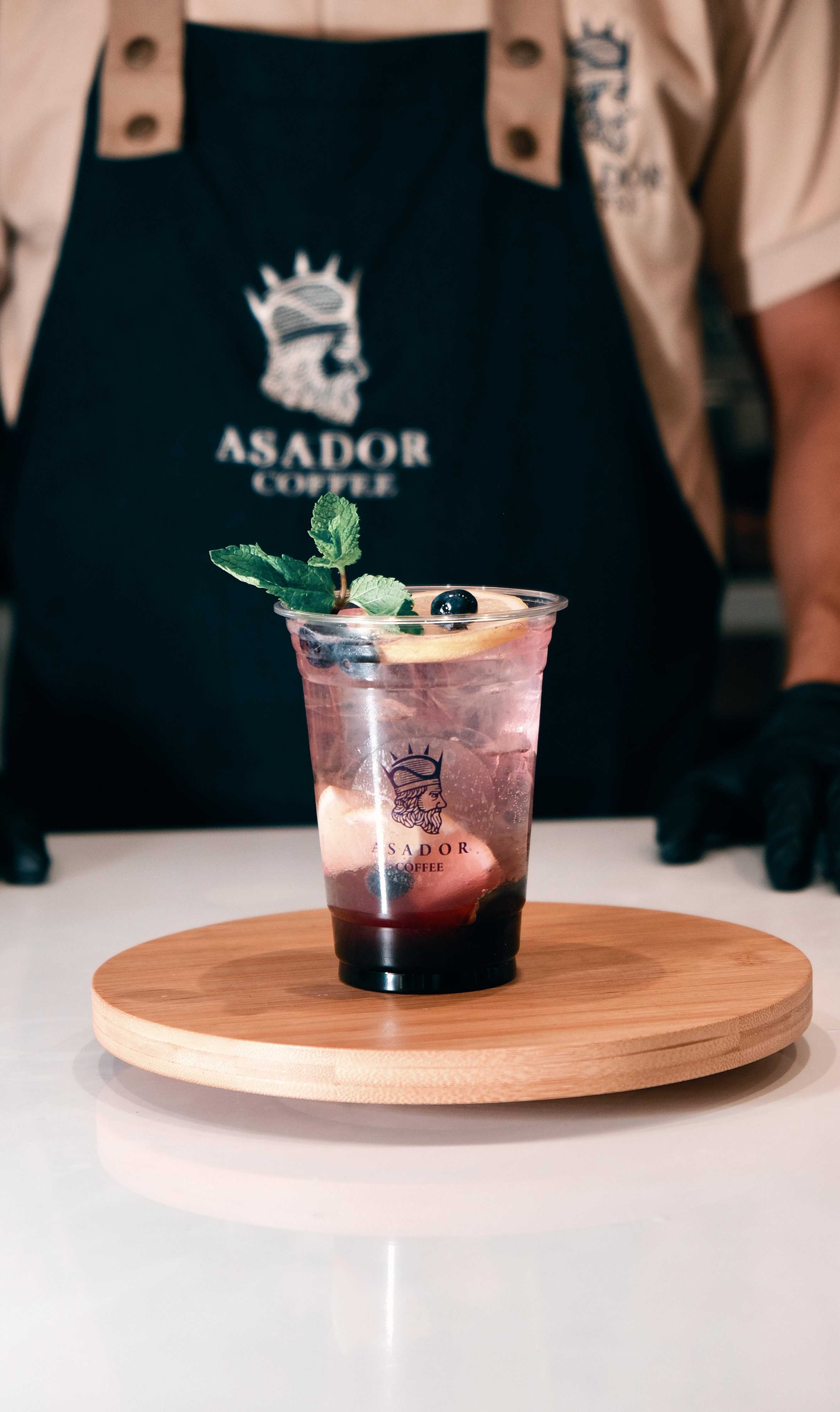 Iced Blueberry Mojito Berry Splash with Fresh Mint in Plastic Cup at Asador Coffee El Jadida