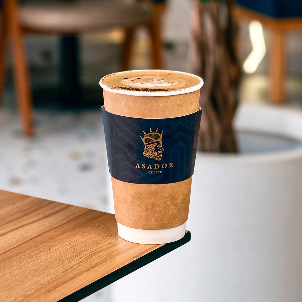 Classic Cappuccino with Cocoa Powder Dusting on Wooden Board at Asador Coffee El Jadida