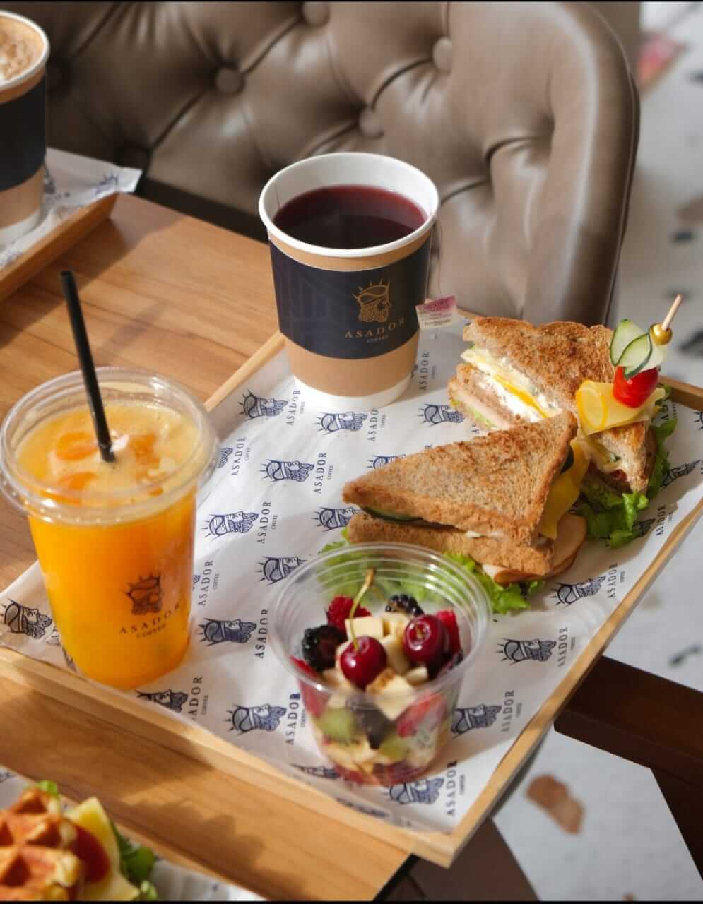 Signature Asador Breakfast Set with Smoked Turkey Club Sandwich, Granola Yogurt, and Fresh Juice at Asador Coffee El Jadida