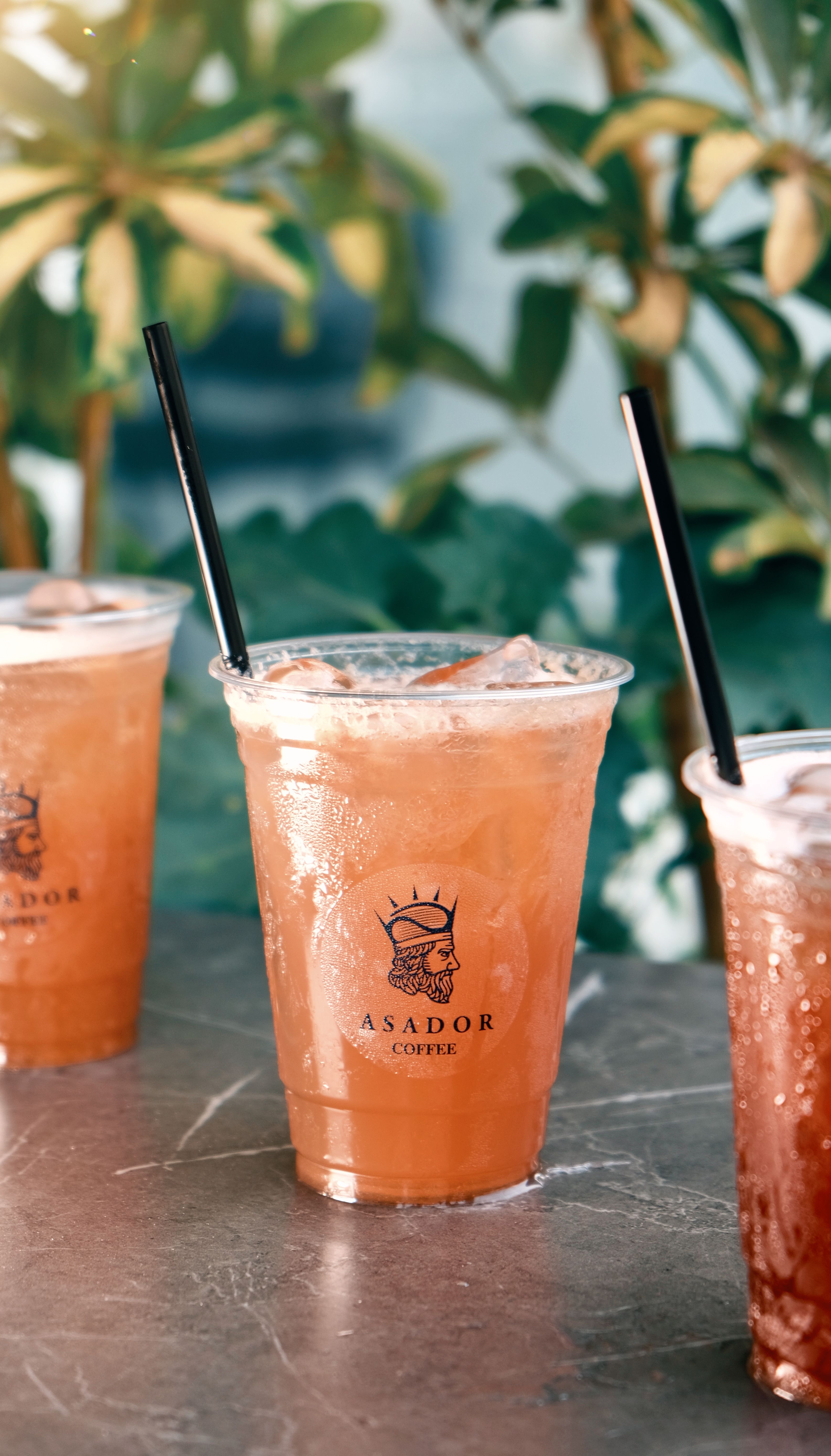 Iced Lemon Tea Drink with Fresh Lemon Slices in Plastic Cup at Asador Coffee El Jadida