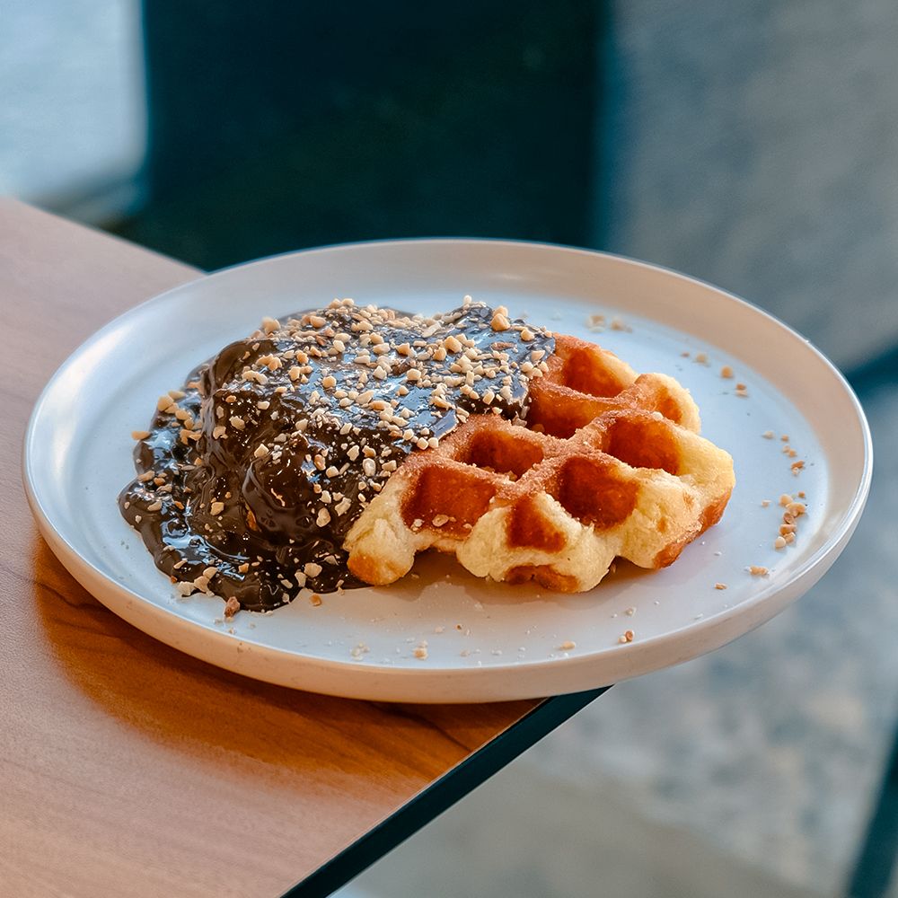 Crunchy Rocher Waffle with Chocolate Sauce and Chopped Hazelnuts at Asador Coffee El Jadida