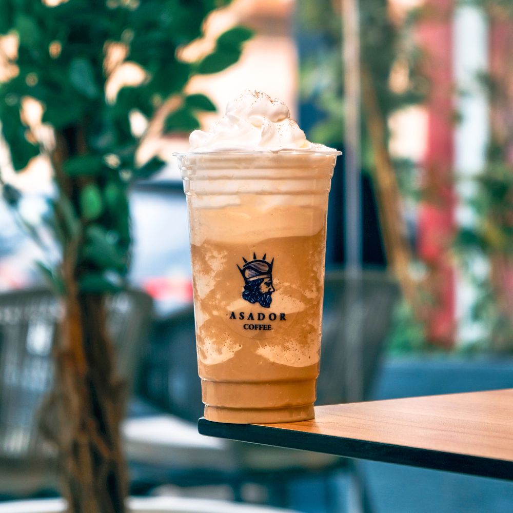 Classic Coffee Frappe with Whipped Cream in Plastic Cup at Asador Coffee El Jadida