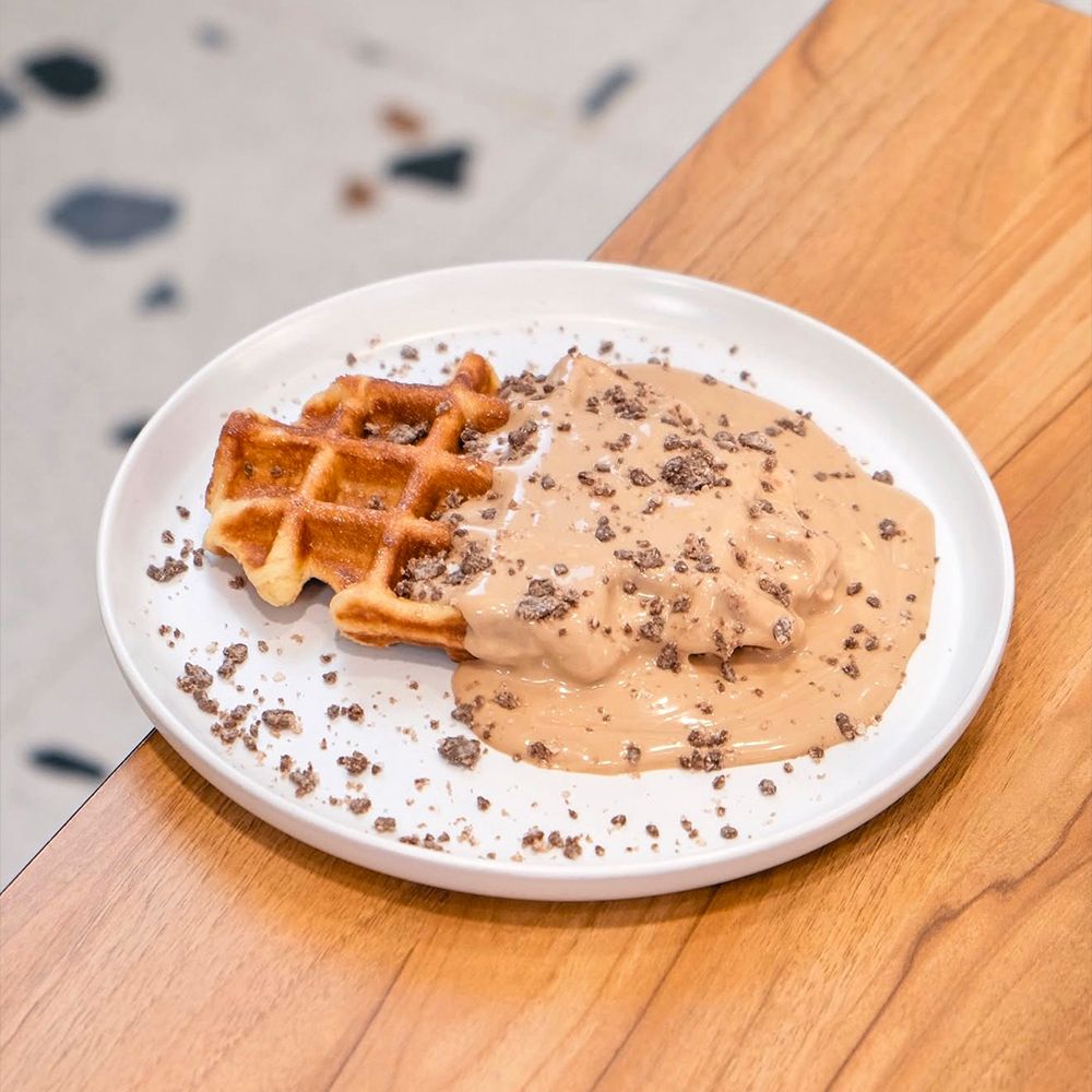 Freshly Baked Bueno Waffle with Hazelnut Cream and Chocolate Drip at Asador Coffee El Jadida