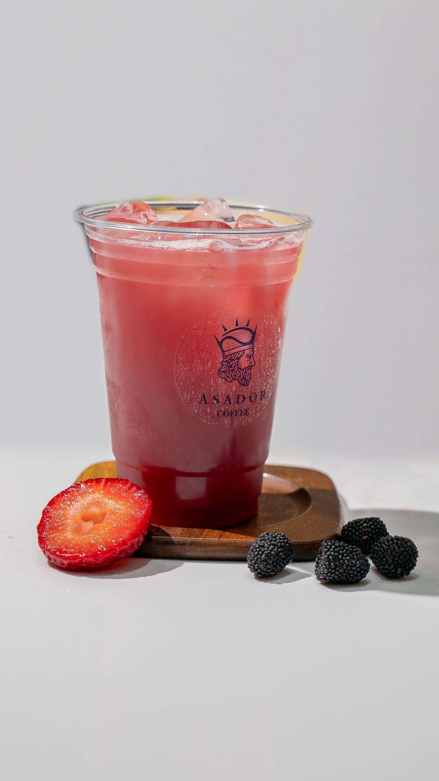 Iced Red Berry Lemonade with Fresh Strawberry and Blackberry Garnish at Asador Coffee El Jadida
