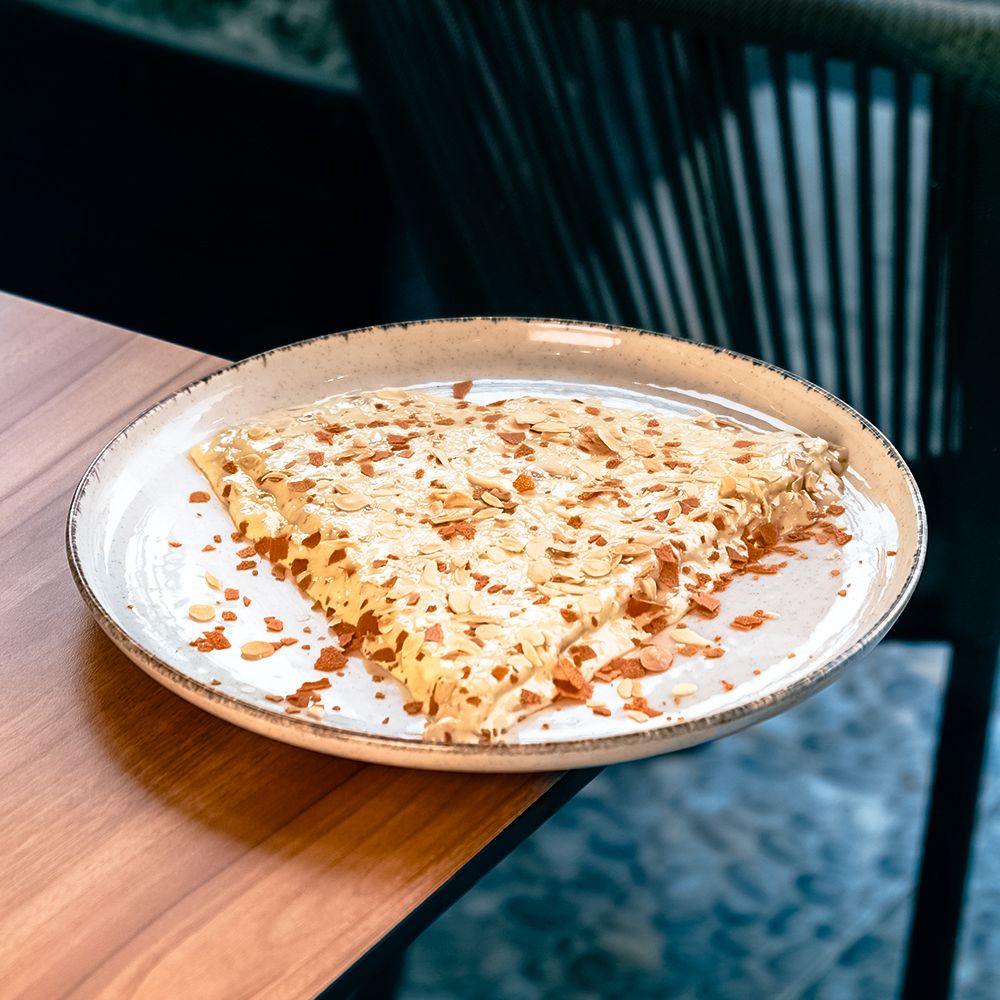 Folded Crepe Raffaello Crispy with Feuilletine Flakes and Coconut White Chocolate Garnish at Asador Coffee El Jadida