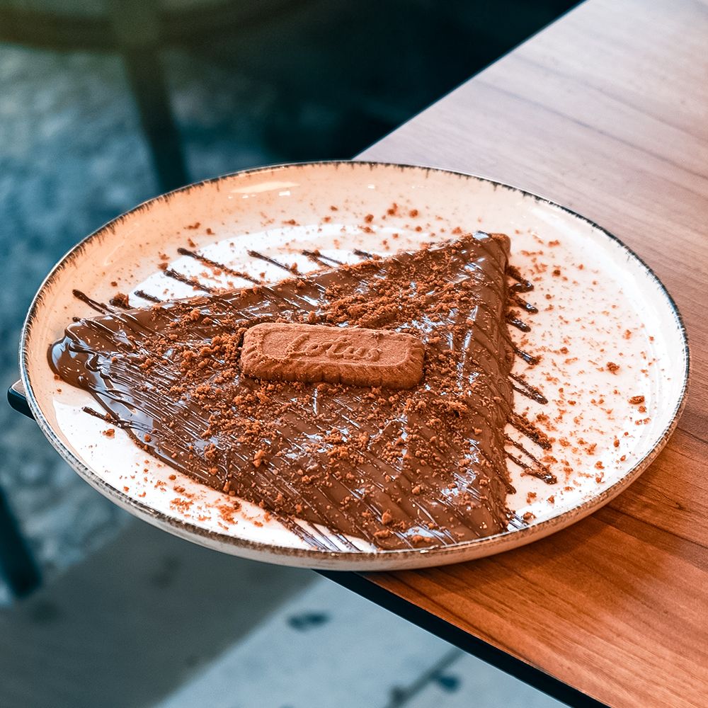 Folded Crepe Lotus with Biscoff Spread and Biscuit Crumbs at Asador Coffee El Jadida