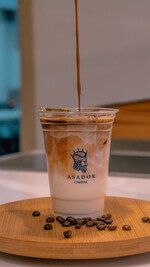 Iced Gold Cappuccino with Caramel and Cold Foam in Plastic Cup at Asador Coffee El Jadida