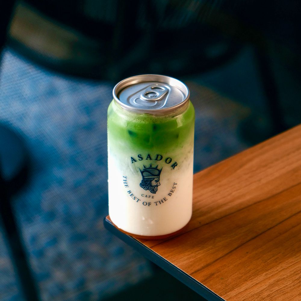 Layered Mango Creamy Matcha in Clear Pop-Top Can at Asador Coffee El Jadida