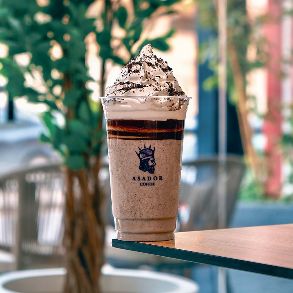 Thick Oreo Milkshake with Whipped Cream and Cookie Garnish in Plastic Cup at Asador Coffee El Jadida