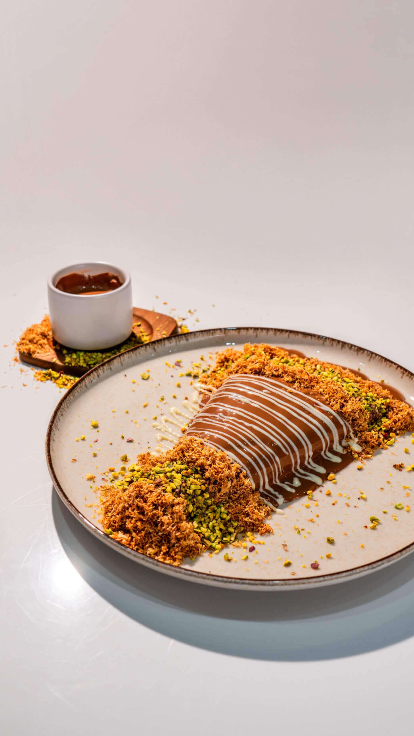 Fusion Crepe Kunafa with Milk and White Chocolate Drizzle and Crispy Pastry at Asador Coffee El Jadida