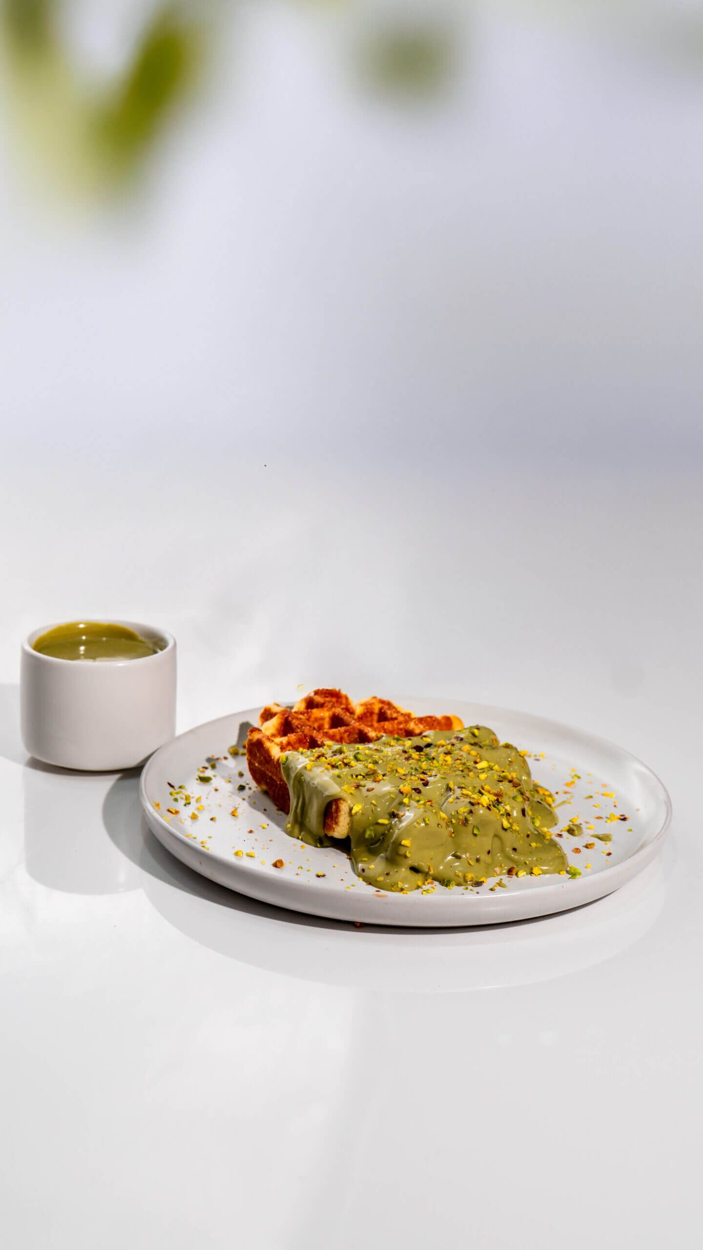 Freshly Baked Pistachio Waffle with Rich Green Nut Cream and Crushed Pistachios at Asador Coffee El Jadida