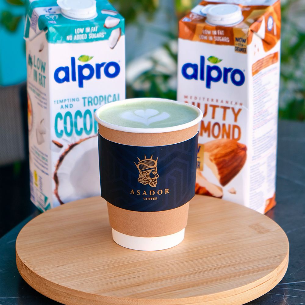 Hot Matcha Green Tea Latte with Latte Art and Alpro Almond and Coconut Milk Options at Asador Coffee El Jadida