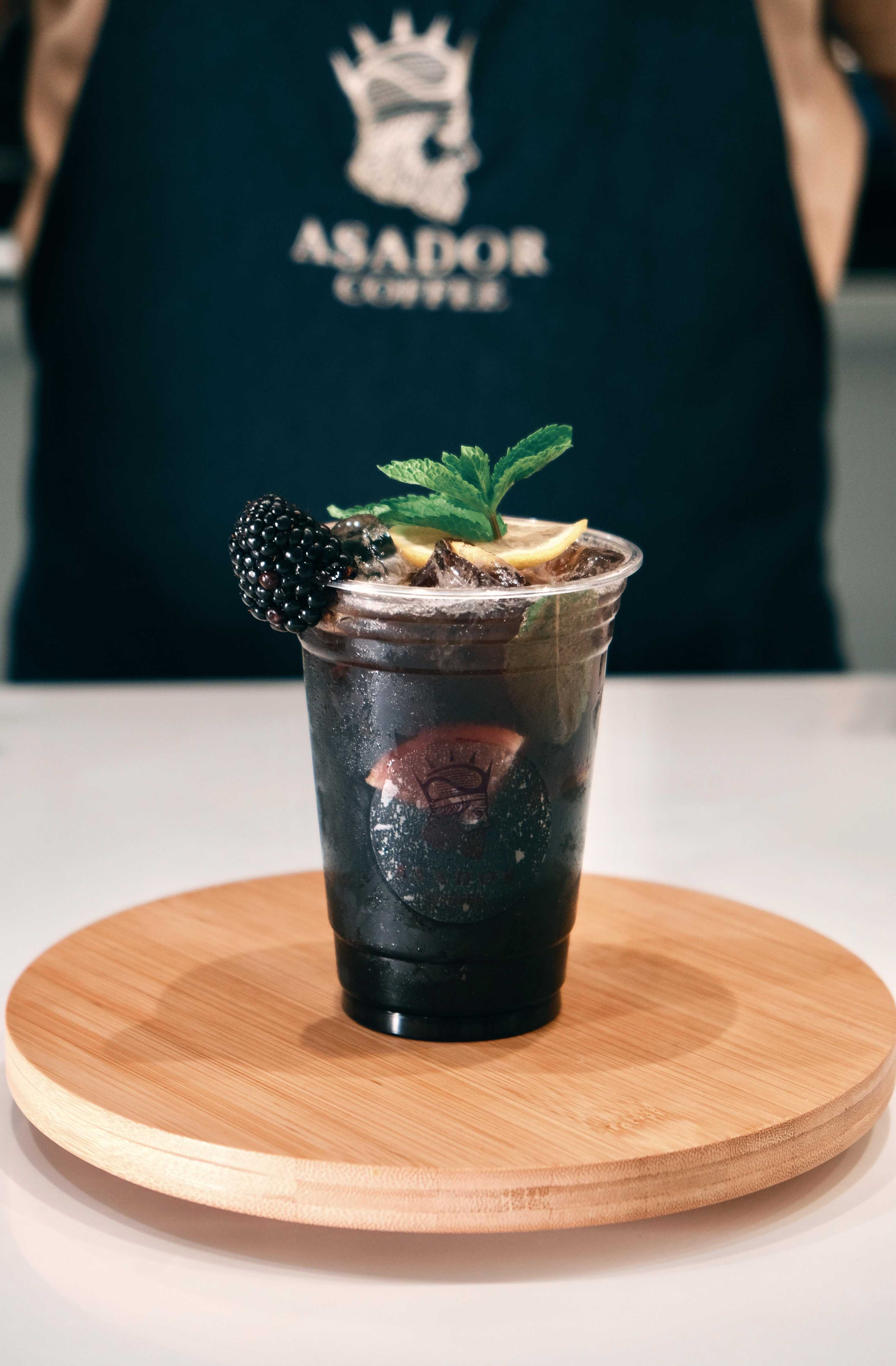 Iced Dark Night Energy Drink Mojito with Blackberry and Mint Garnish at Asador Coffee El Jadida