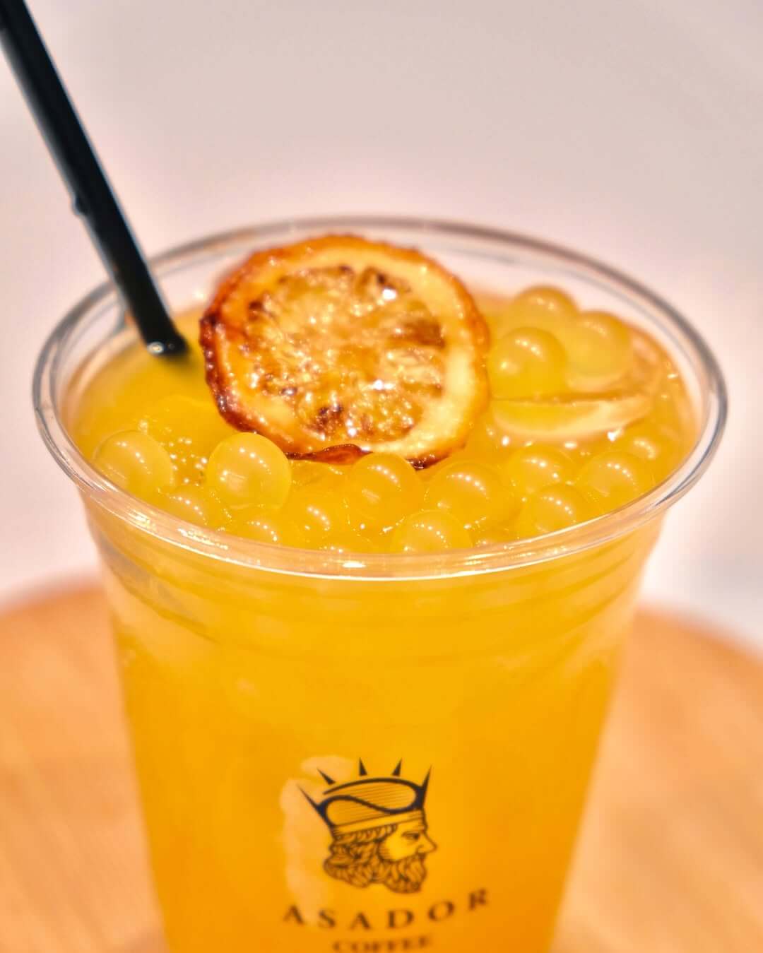 Iced Orange and Passion Fruit O'Hana Bubble Drink with Popping Boba in Plastic Cup at Asador Coffee El Jadida