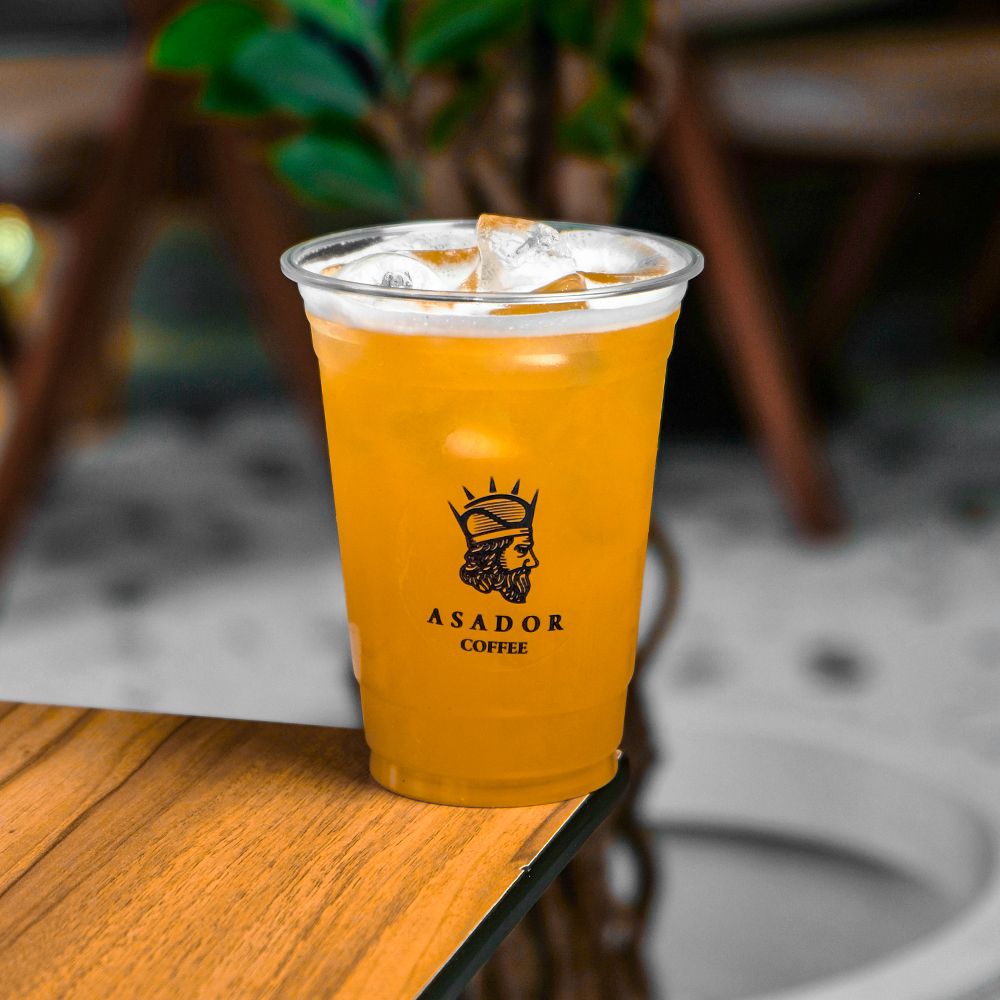 Iced Peach Lemonade Drink in Plastic Cup at Asador Coffee El Jadida
