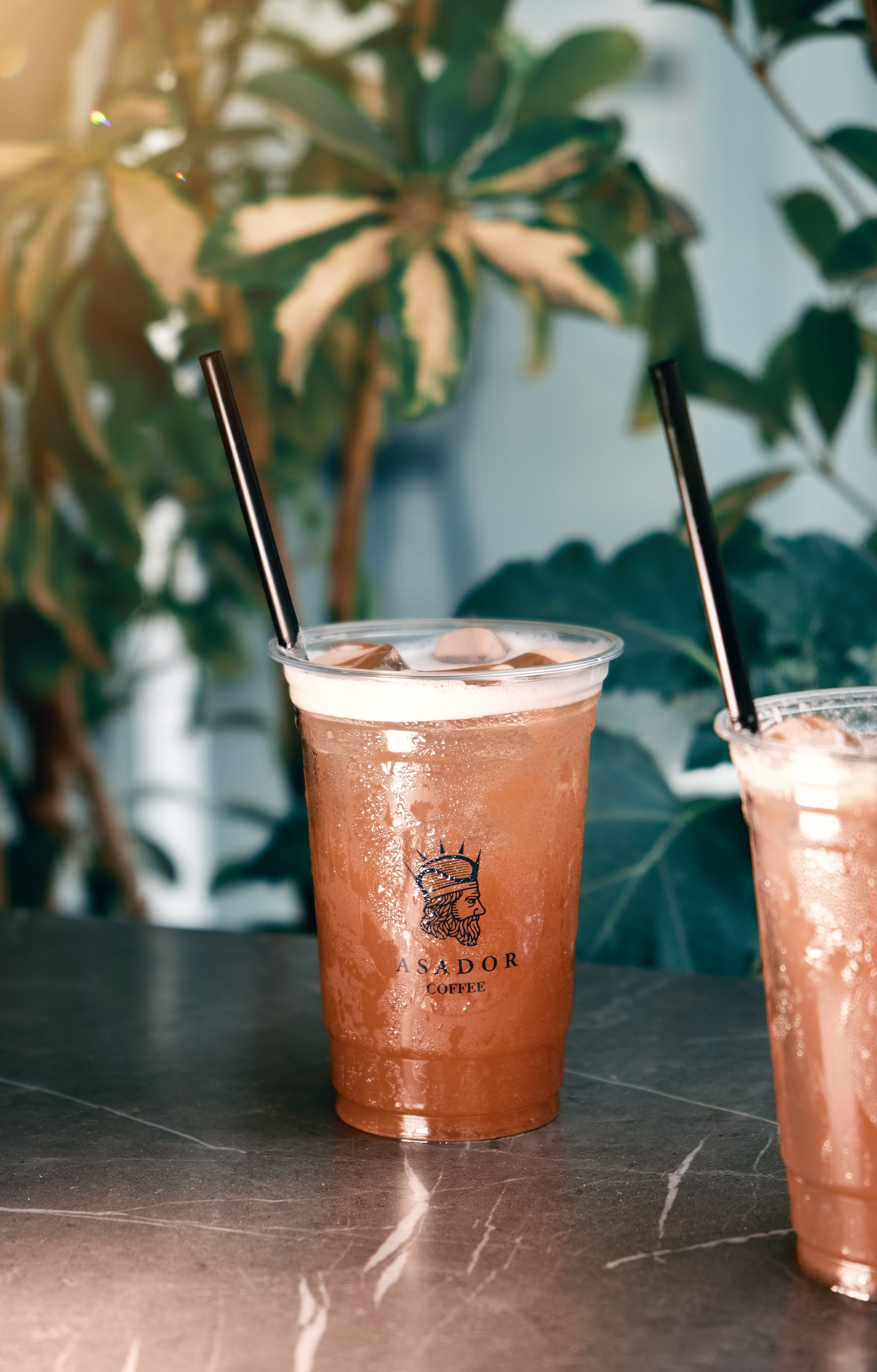 Iced Peach Tea Drink in Plastic Cup at Asador Coffee El Jadida