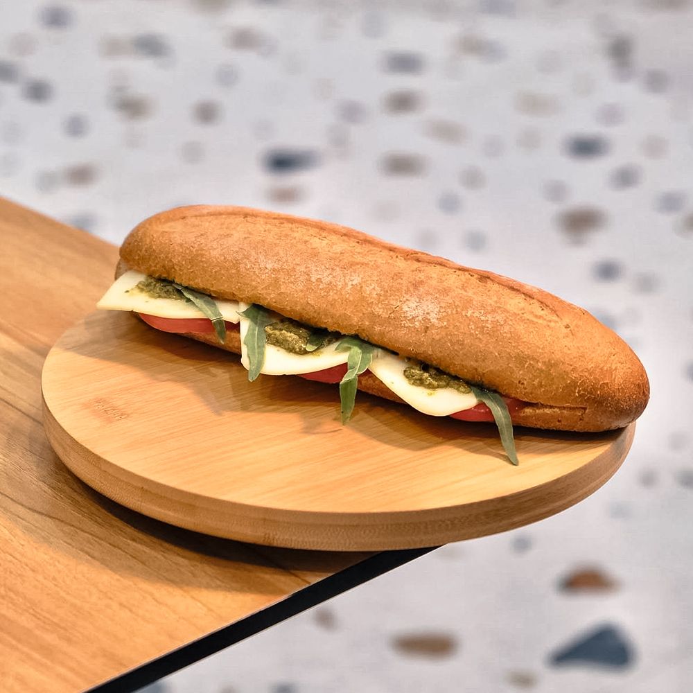 Vegetarian Pesto and Cheese Sandwich on Wooden Plate at Asador Coffee El Jadida